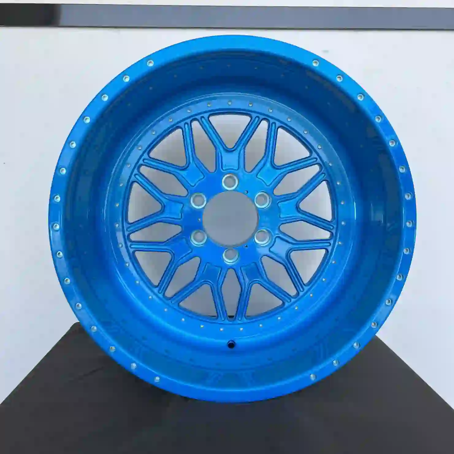 Front view of deep dish forged 20-28 inch chrome blue wheels for GMC Sierra 1500 2500 and 3500