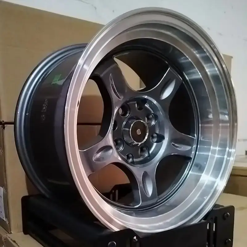 Real photo left view of hot selling cast aluminum alloy silver wheels 15inch 4x100 4x114.3 PCD for Honda Fit Suzuki Swift