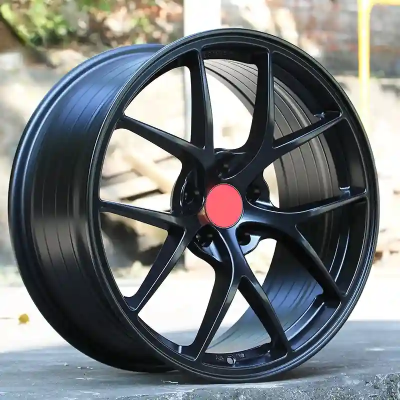 Real shot picture left view of aftermarket cast aluminum alloy matt black 4x100 PCD wheel 16-20 inch rims